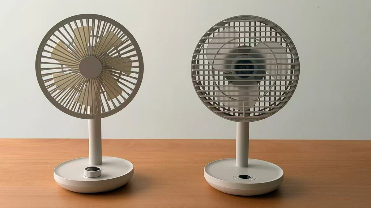 Engineering functional prototype of a portable fan showing the battery, PCB, motor and internal structure for testing.